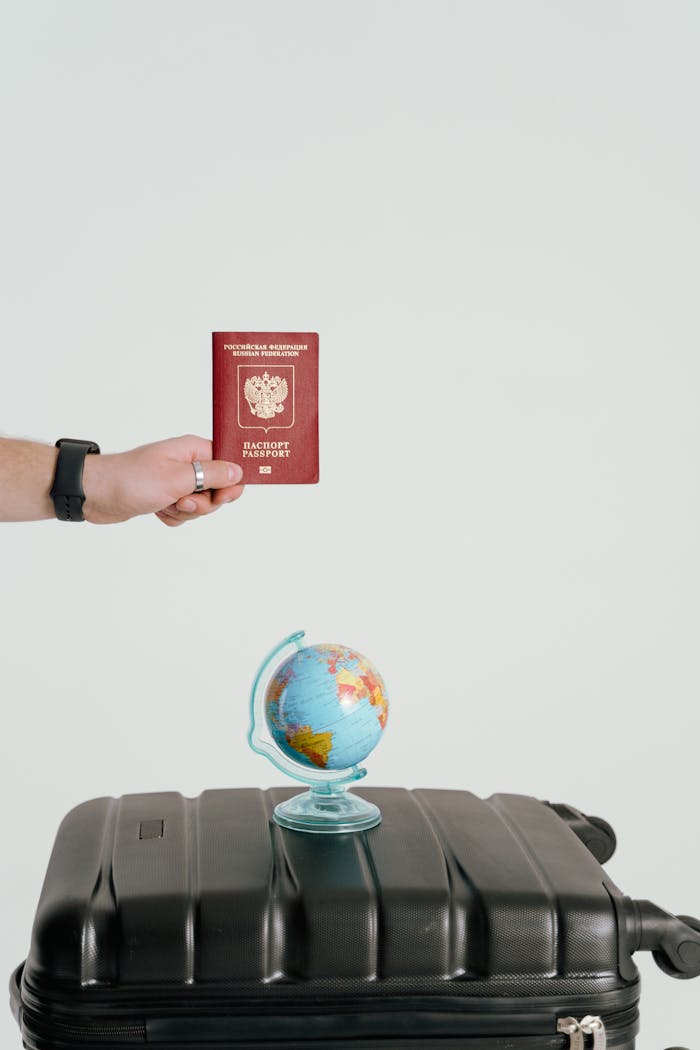 hero-img-01 Passport, globe, and suitcase symbolize travel and adventure aspirations.